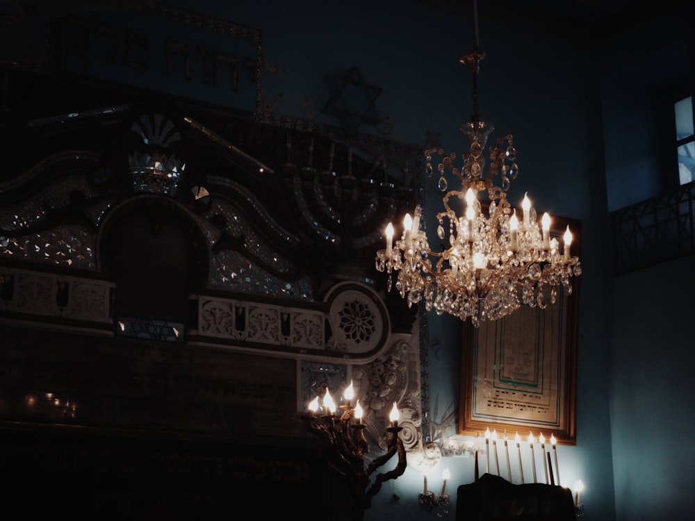 a chandelier hanging from the ceiling in a dark room