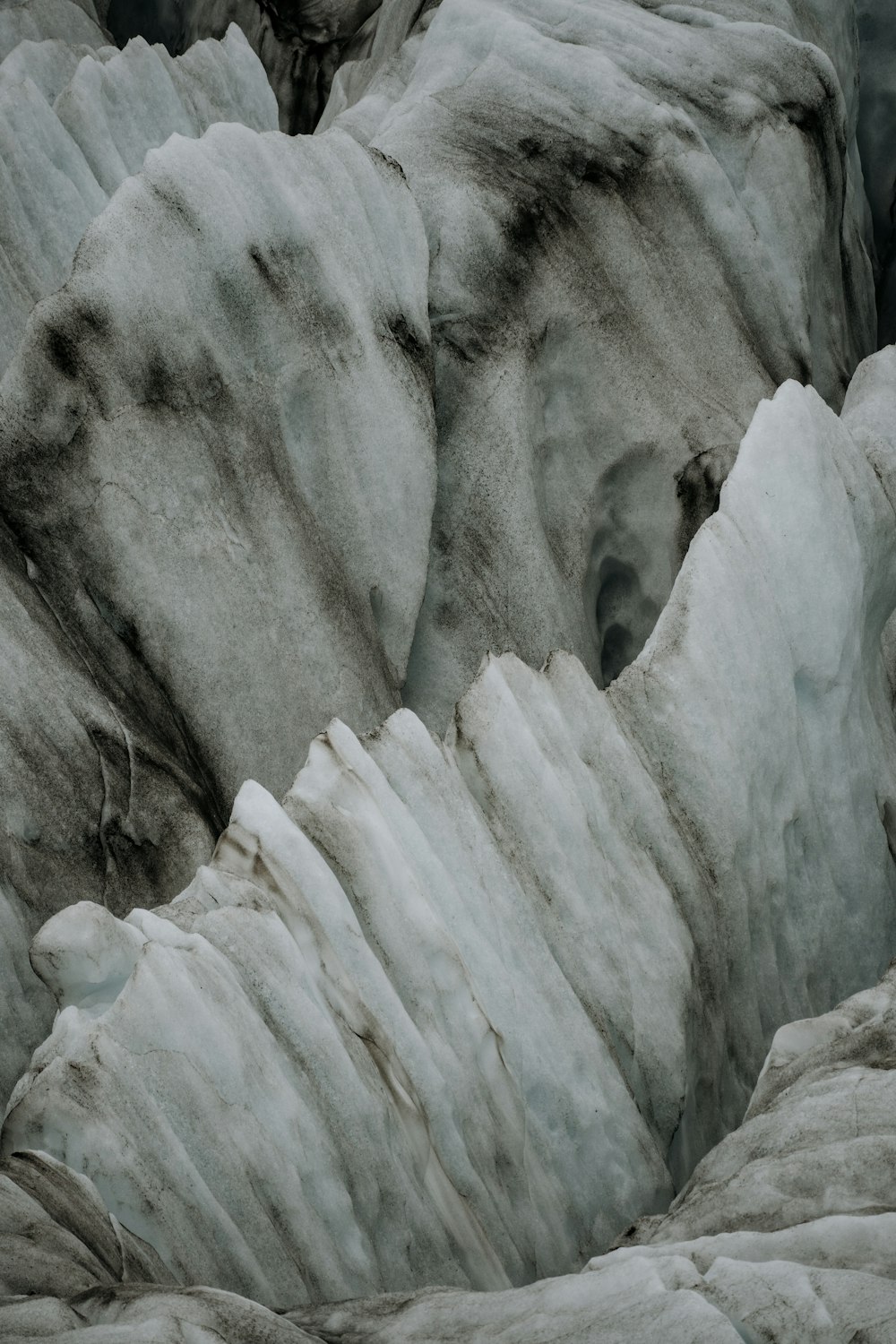 a black and white photo of ice formations