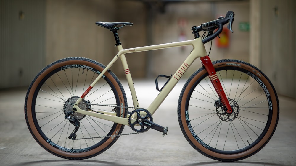 a bike parked in a parking garage next to a wall