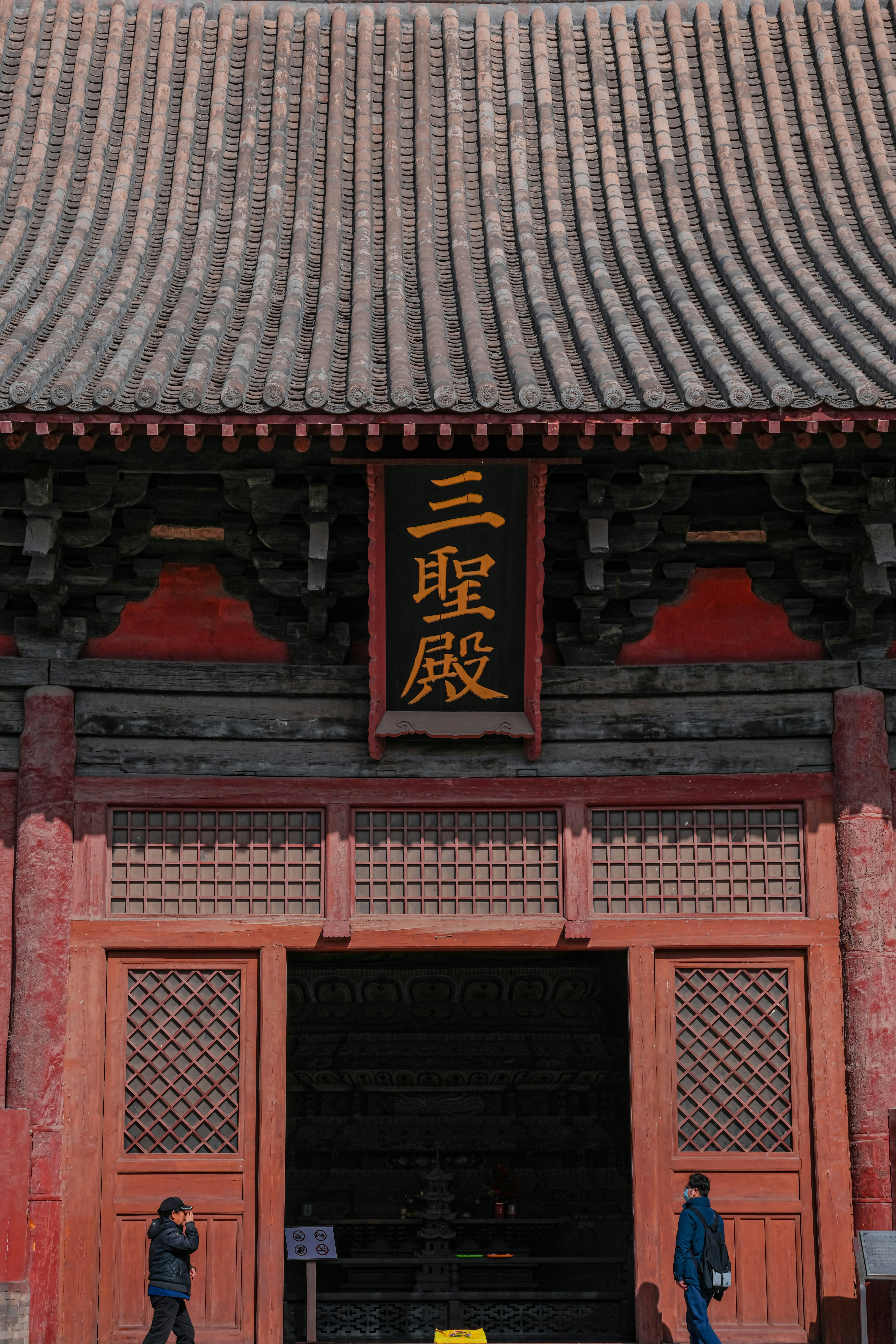 a couple of people that are standing in front of a building