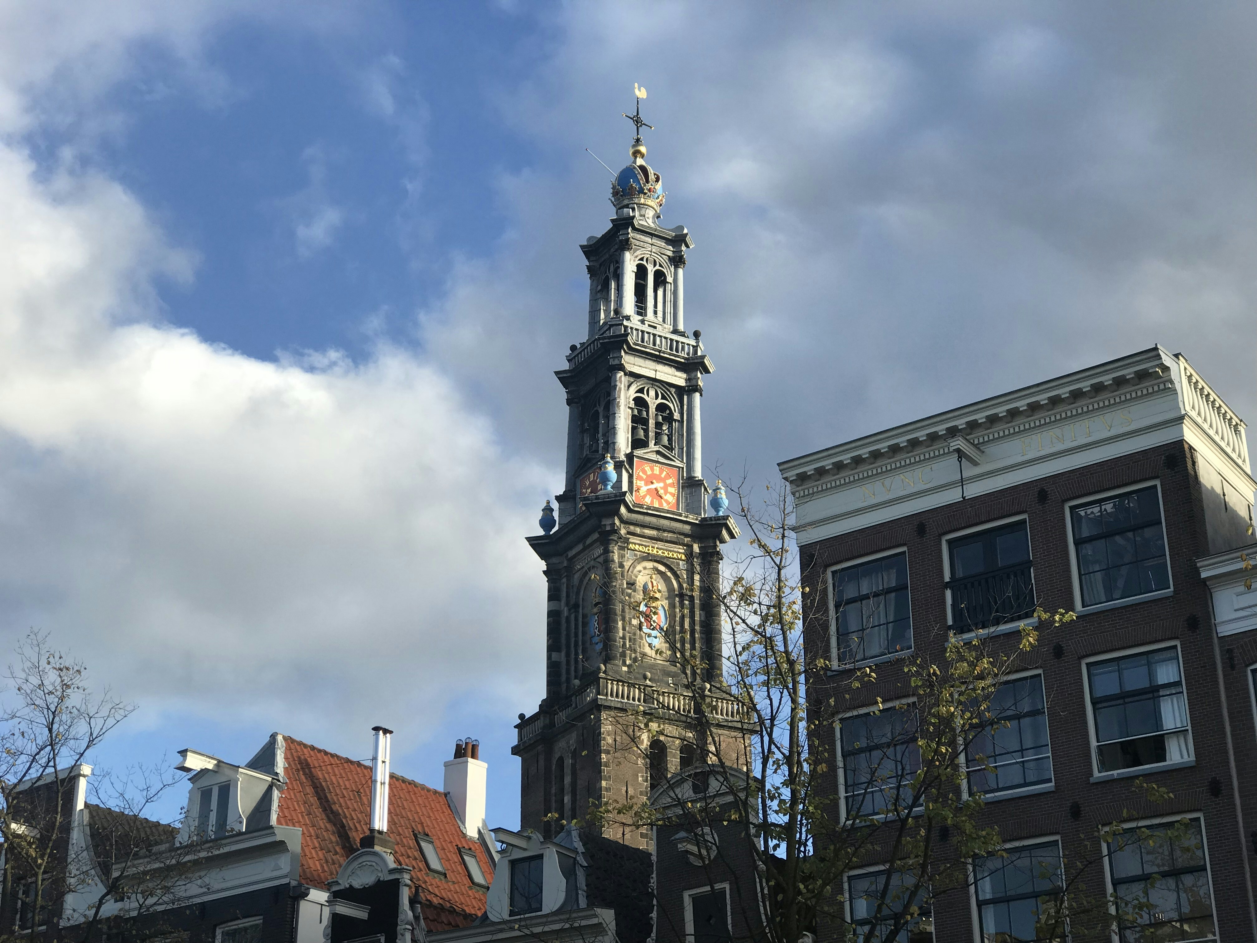 a tall clock tower towering over a city