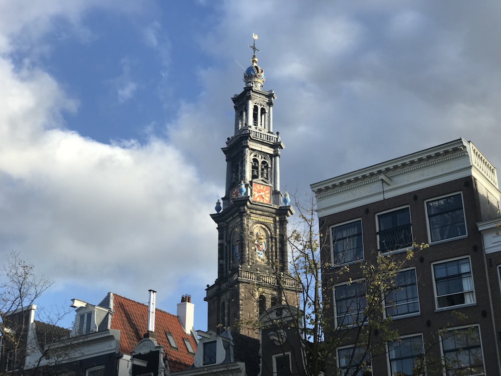 a tall clock tower towering over a city