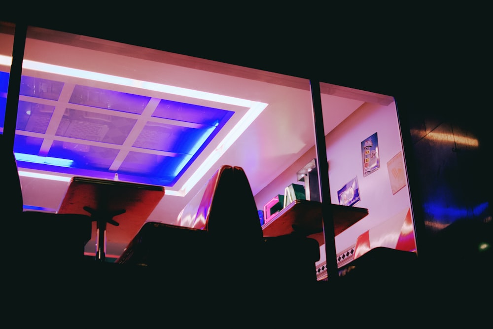 a group of people sitting in front of a window