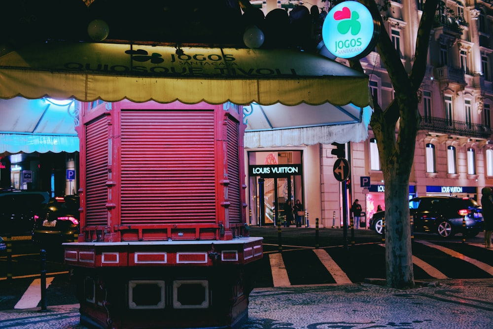 a red and yellow building on a city street