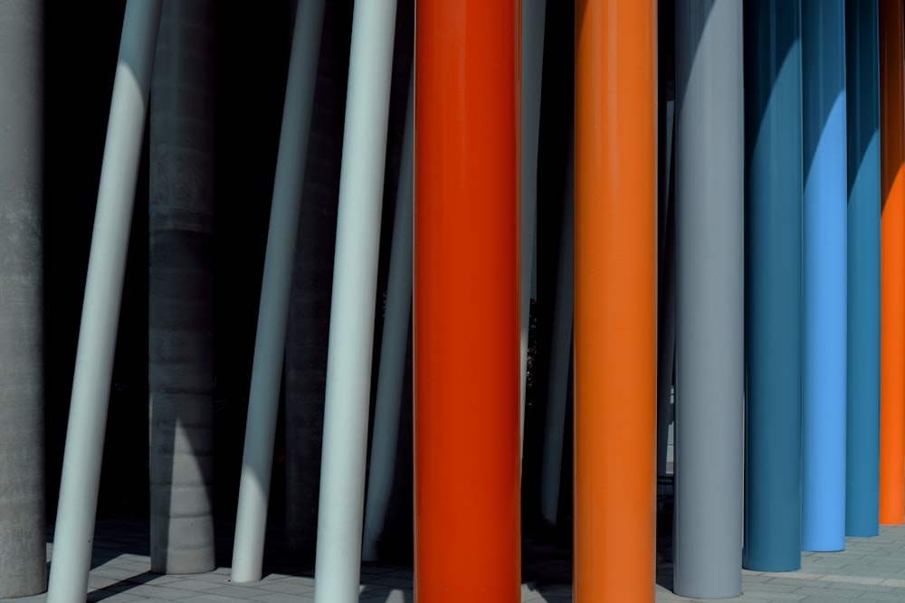 a row of different colored poles next to each other