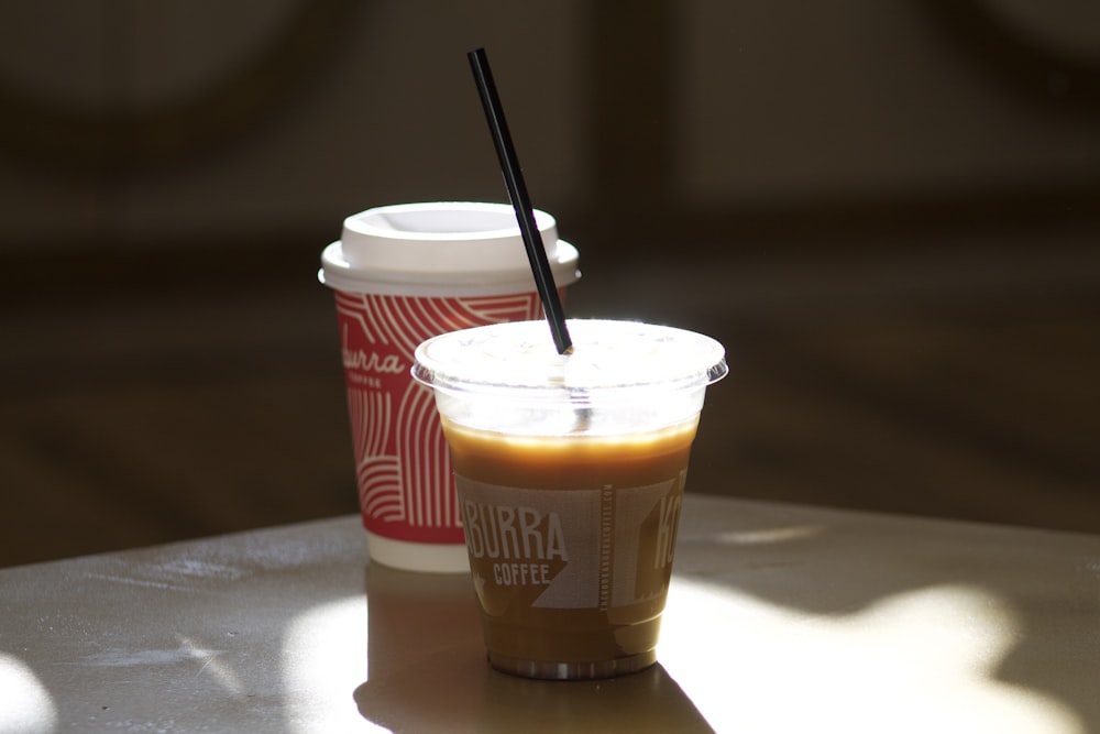 two cups of coffee sitting on a table