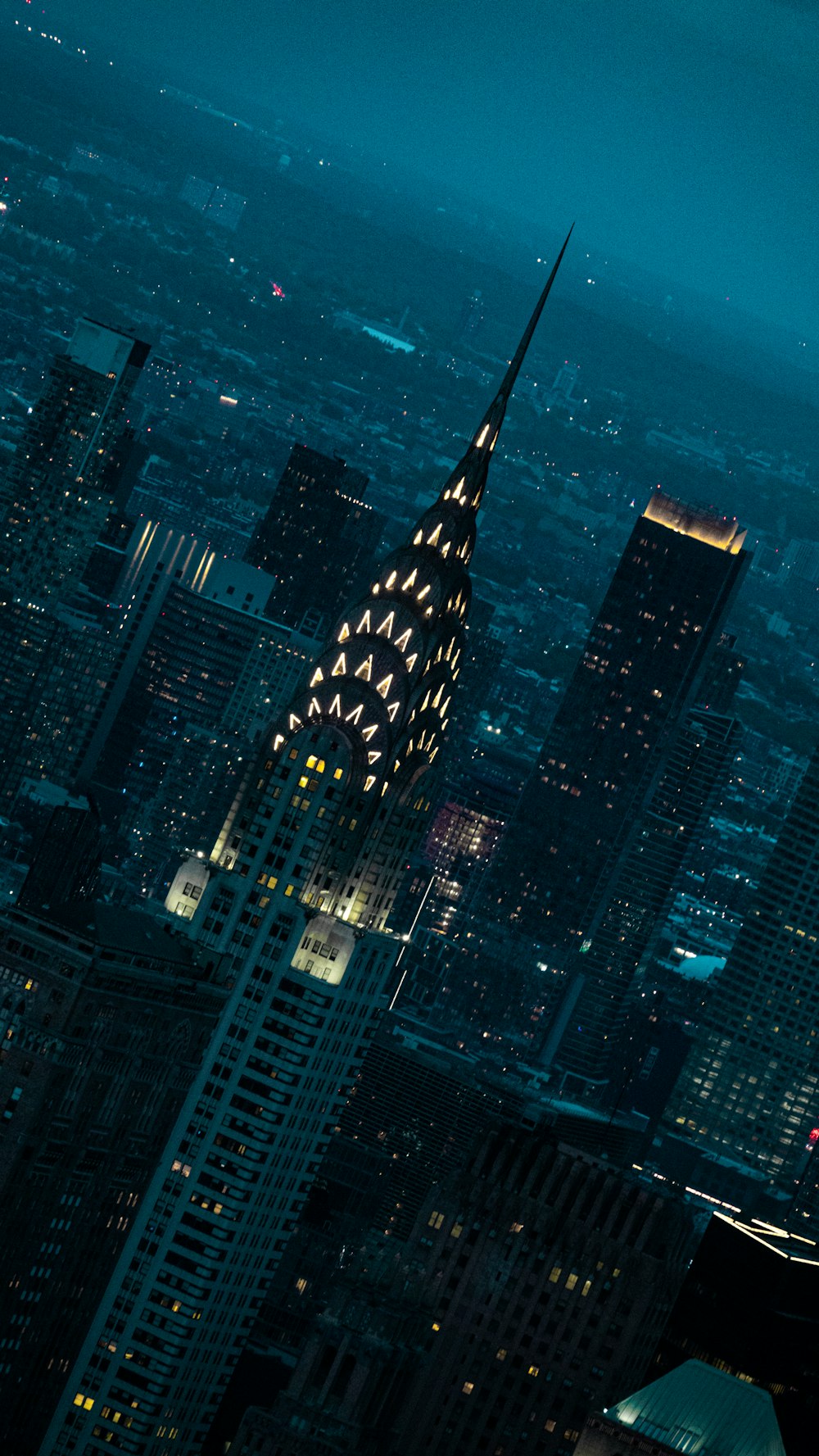 a view of a city at night from the top of a building