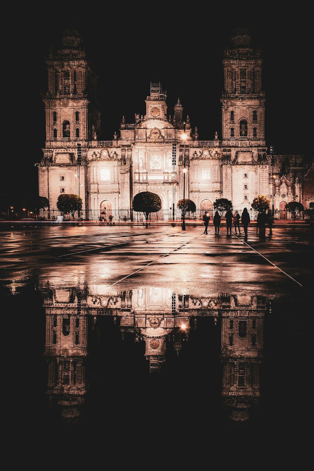 a large building with a clock tower at night