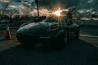 a black sports car parked on the side of the road