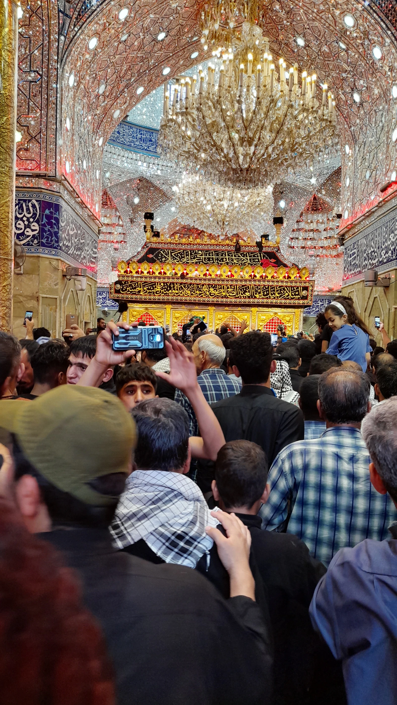 Inside the shrine: mirror work, chandeliers, and pilgrims
