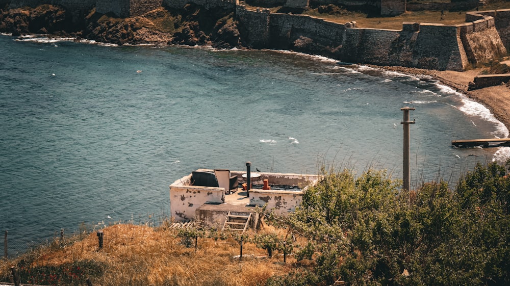 a boat sitting on top of a body of water