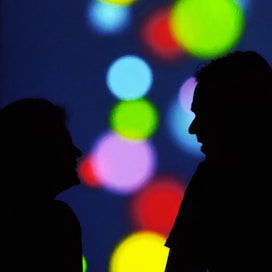 a couple of people standing next to each other