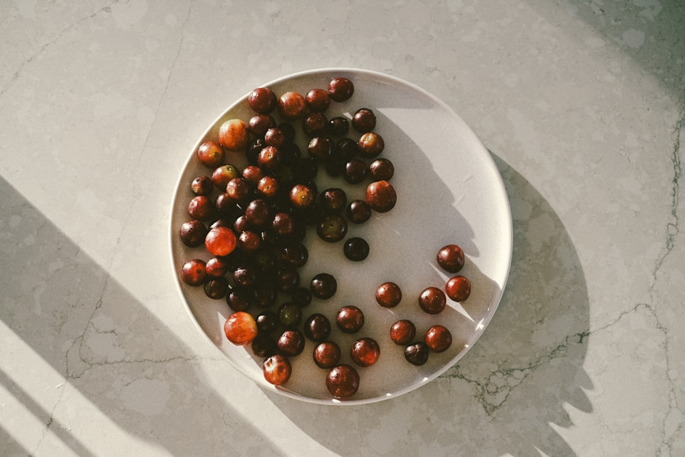 a white bowl filled with nuts on top of a table