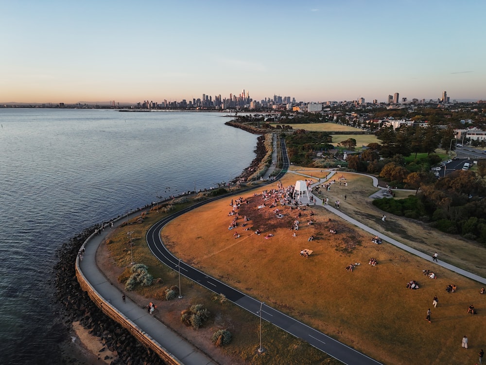 an aerial view of a large body of water with a city in the background