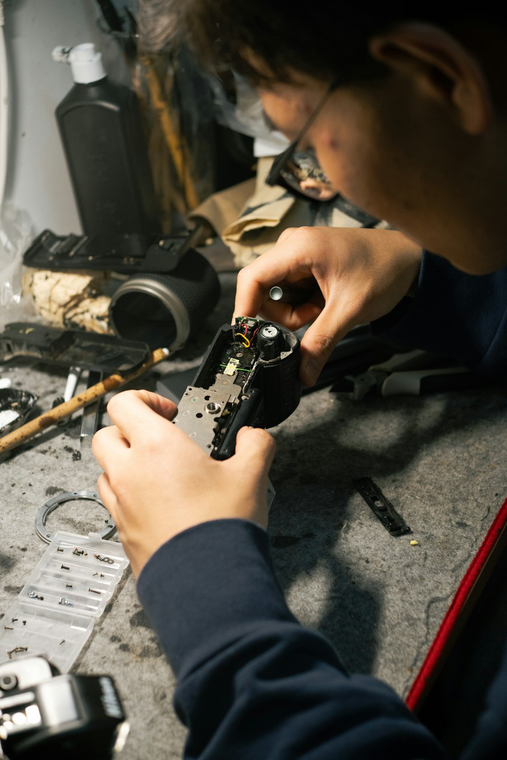 a man is working on a piece of metal