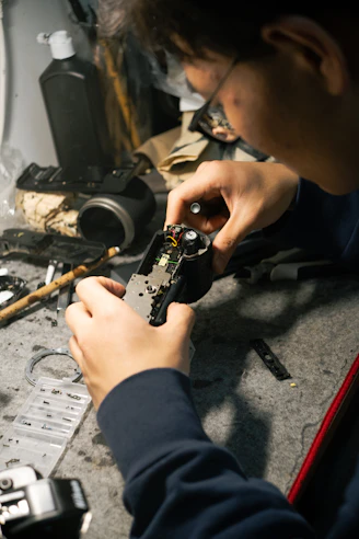 a man is working on a piece of metal