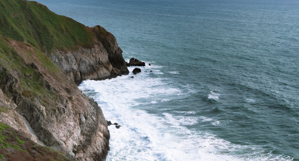 a view of the ocean from the top of a cliff