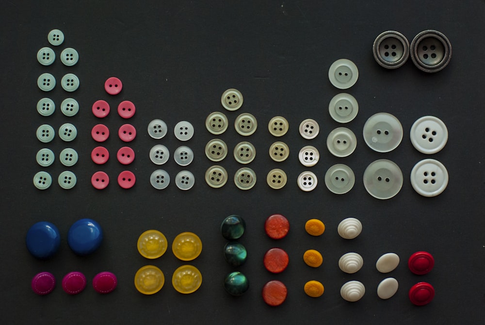 a collection of buttons and buttons on a table