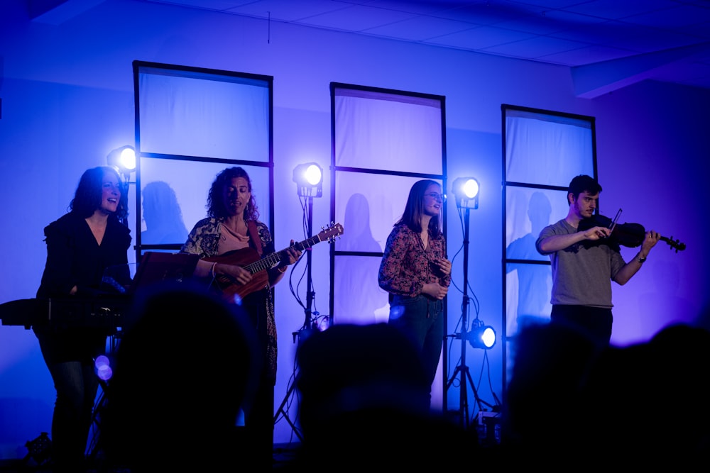 a group of people that are standing on a stage