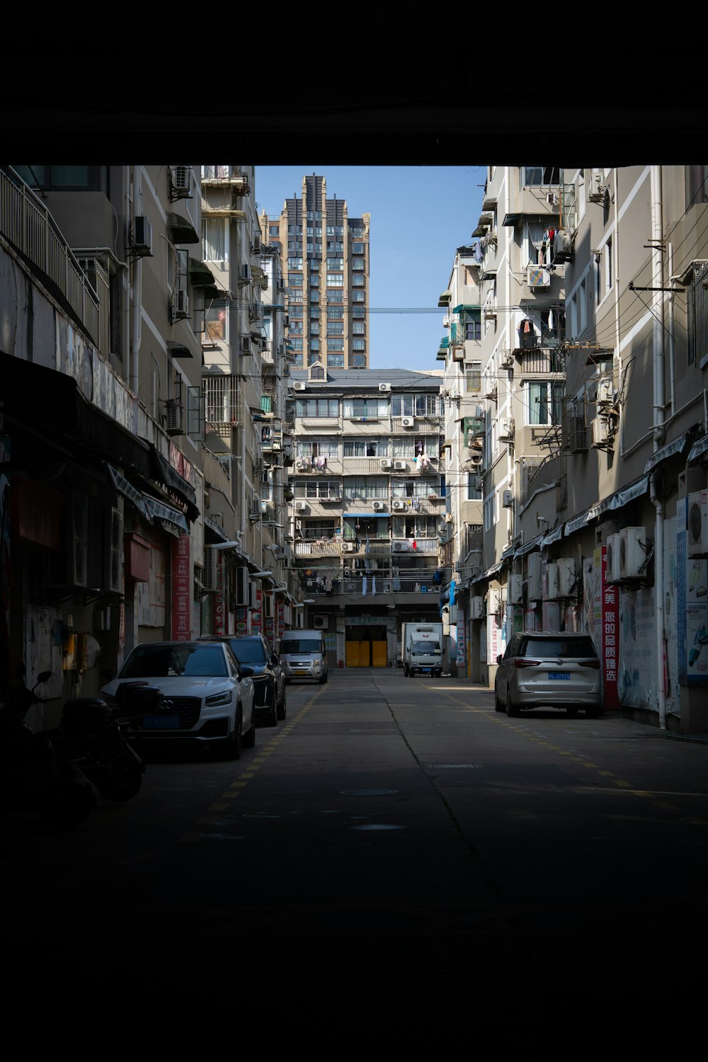 a city street filled with lots of tall buildings