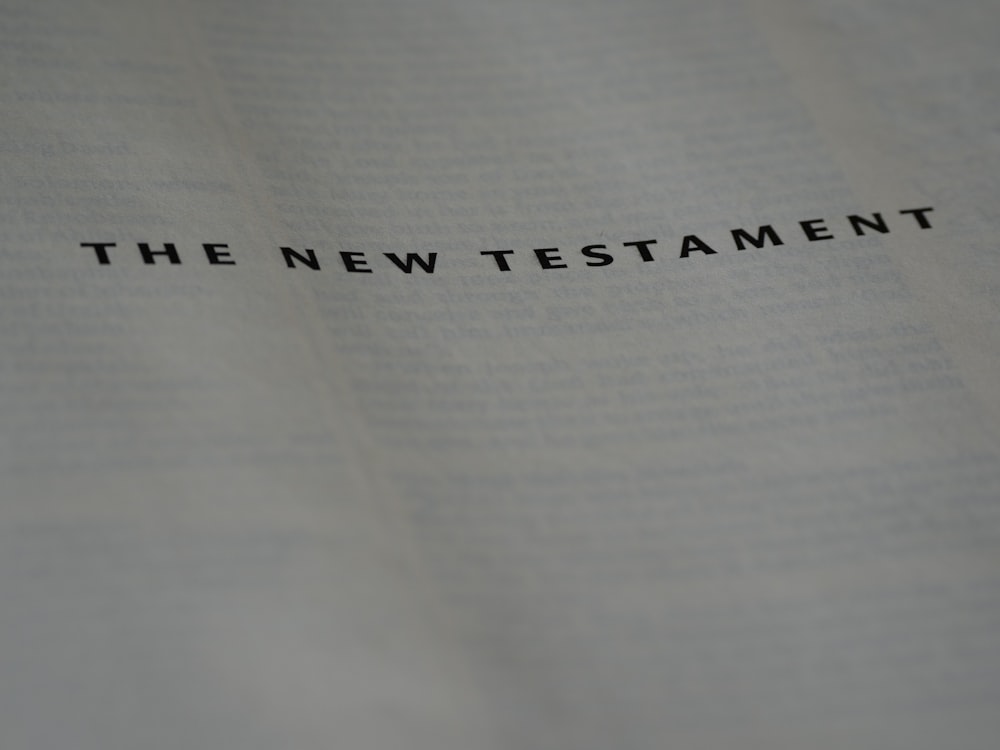 a close up of a book with the word the new testament on it