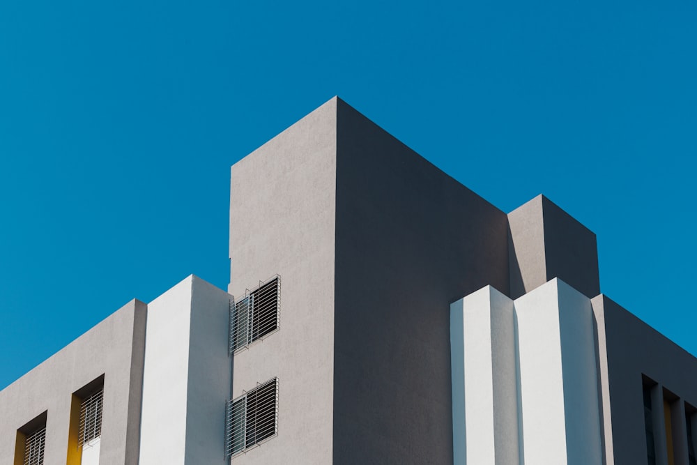 a tall building with two windows on the side of it