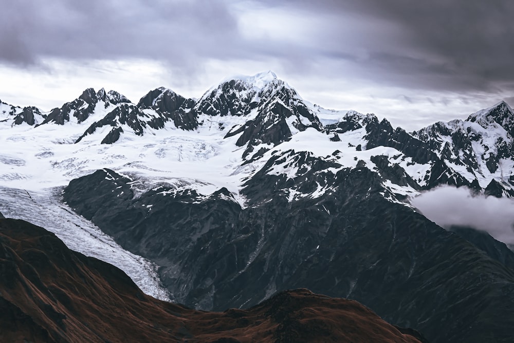 a view of a mountain range covered in snow