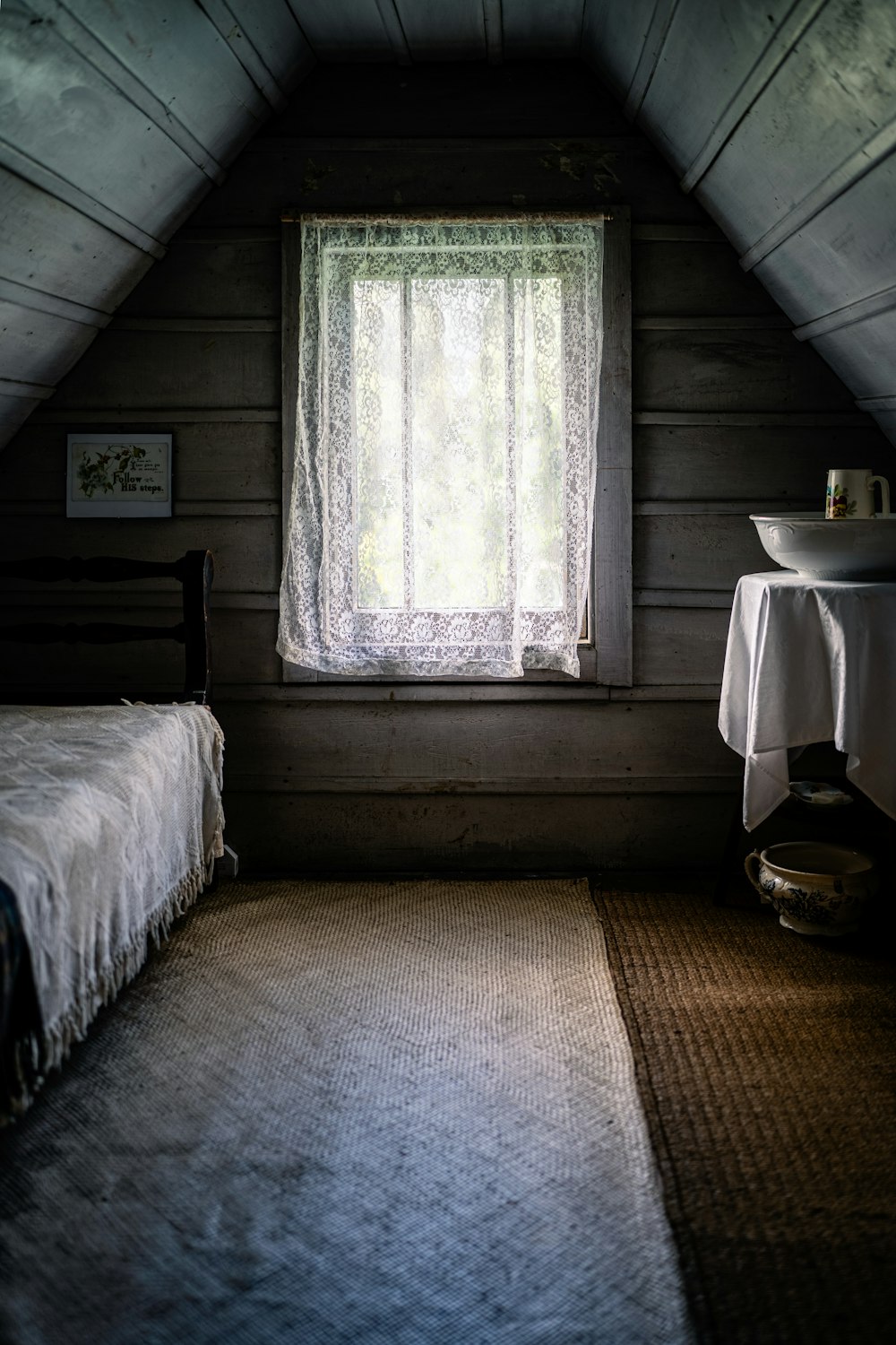a bedroom with a bed and a window in it