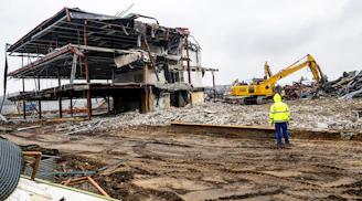 a man standing in front of a construction site