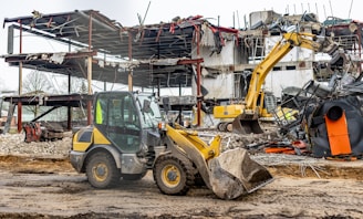 a bulldozer is parked in front of a construction site