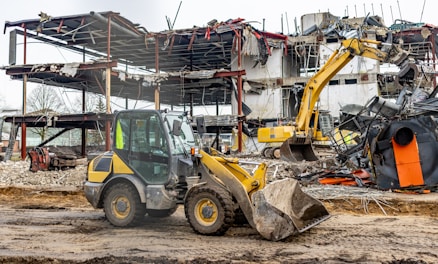 a bulldozer is parked in front of a construction site
