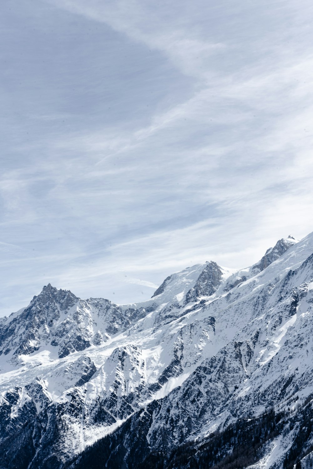 a man riding skis on top of a snow covered slope