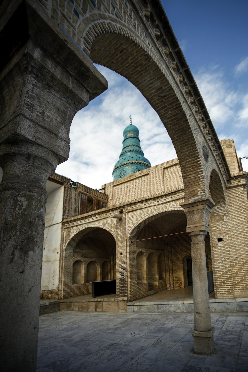 a tall building with a blue dome on top of it