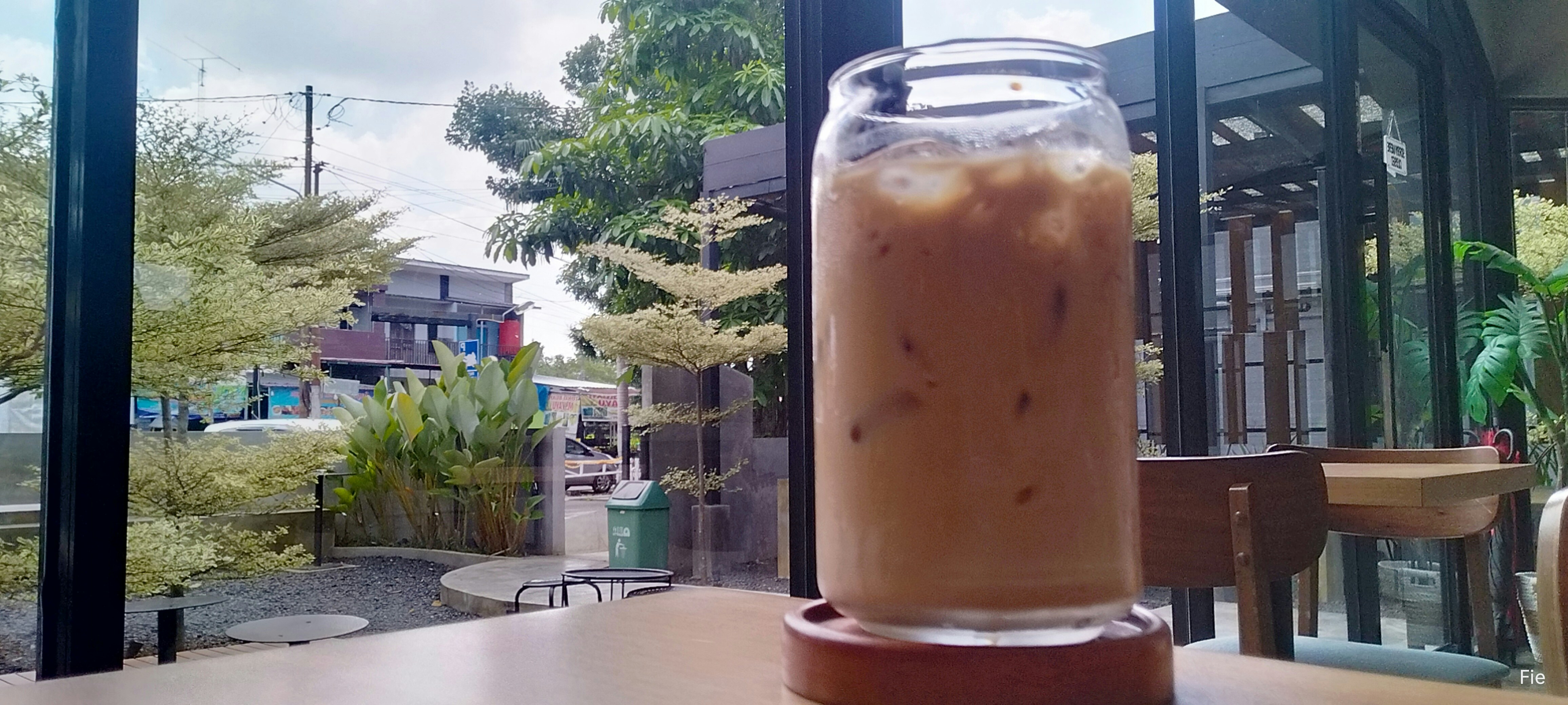 a drink sitting on top of a wooden table