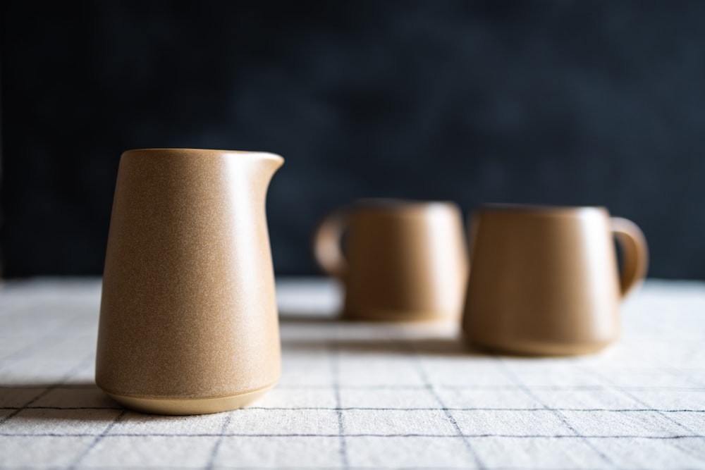 a couple of cups sitting on top of a table