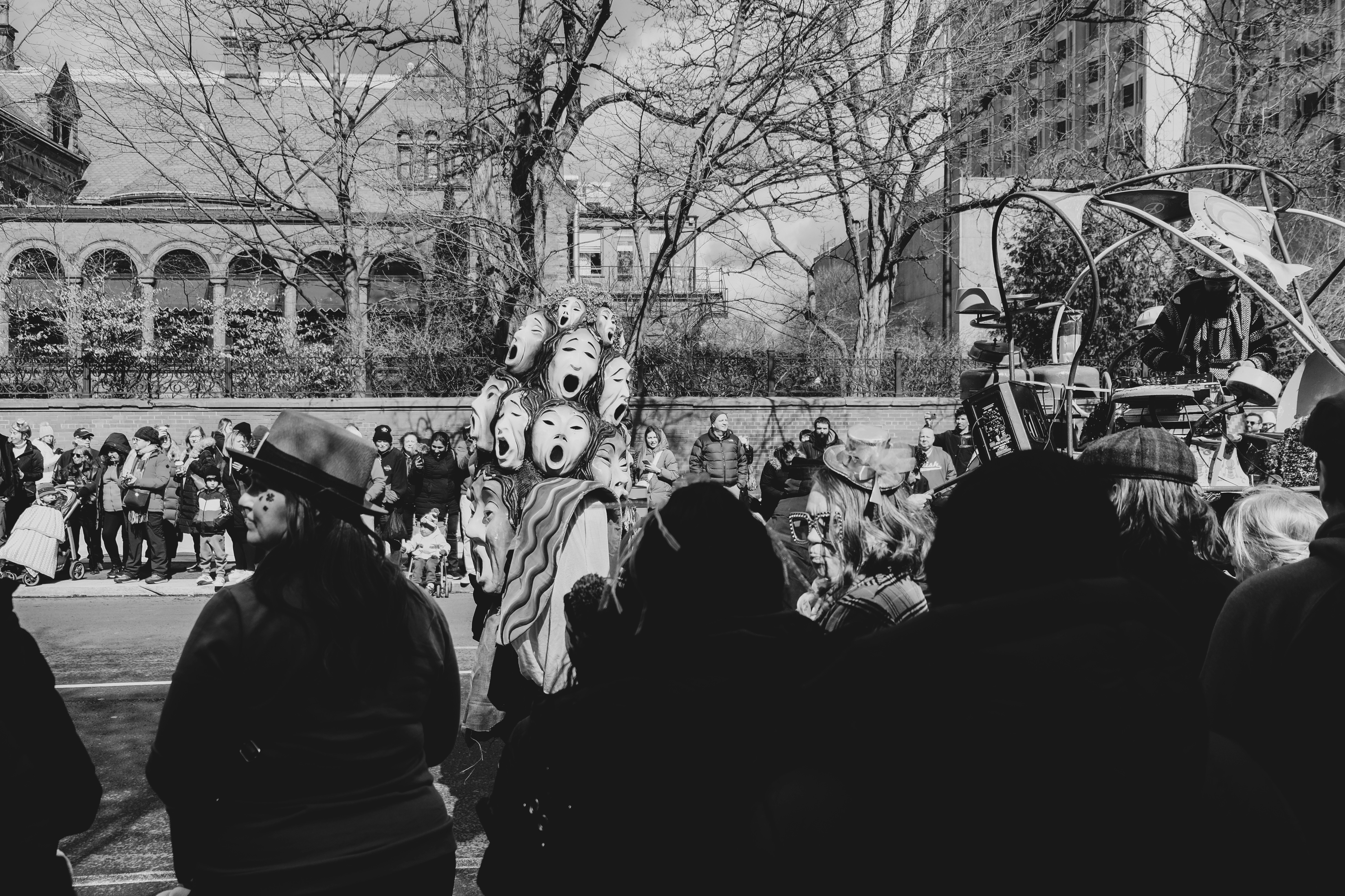 a group of people standing around a carnival float