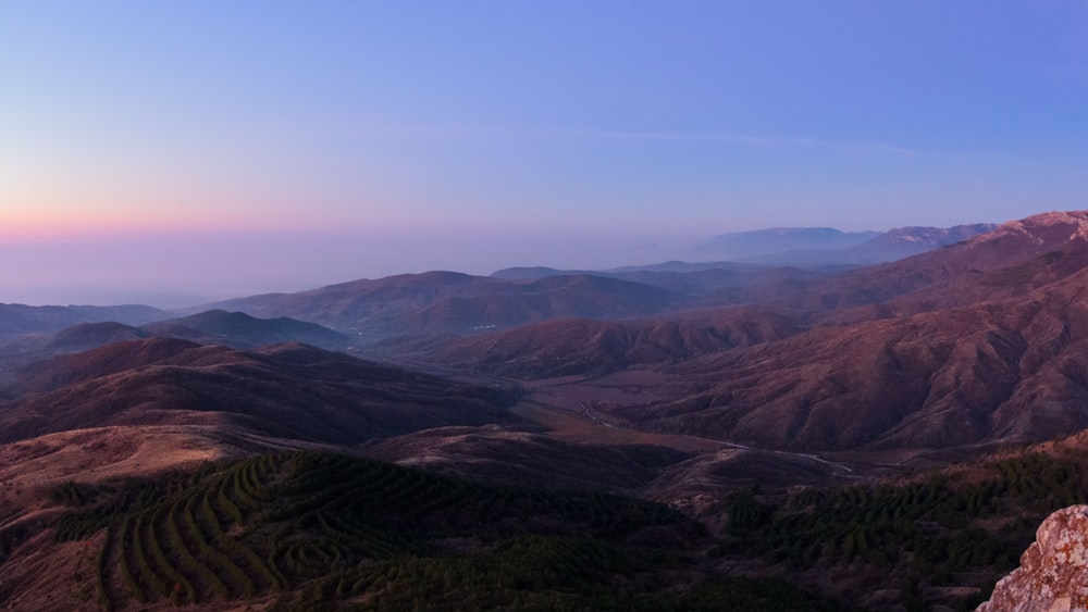 a view of a mountain range at sunset