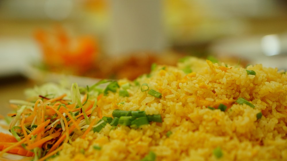a close up of a plate of rice and vegetables