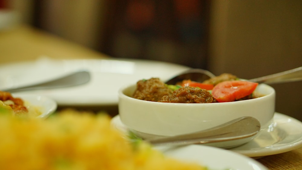 a close up of a bowl of food on a table