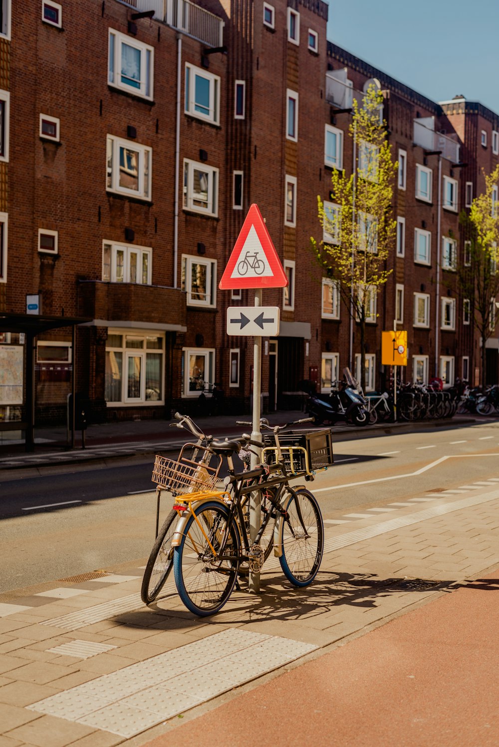 a couple of bikes parked on the side of a road