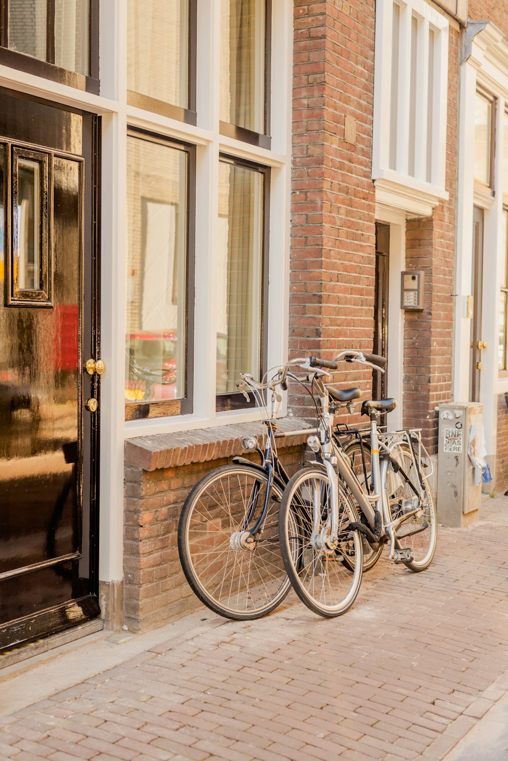 a couple of bikes parked next to a building