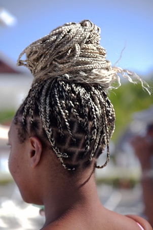 a woman with braids in her hair