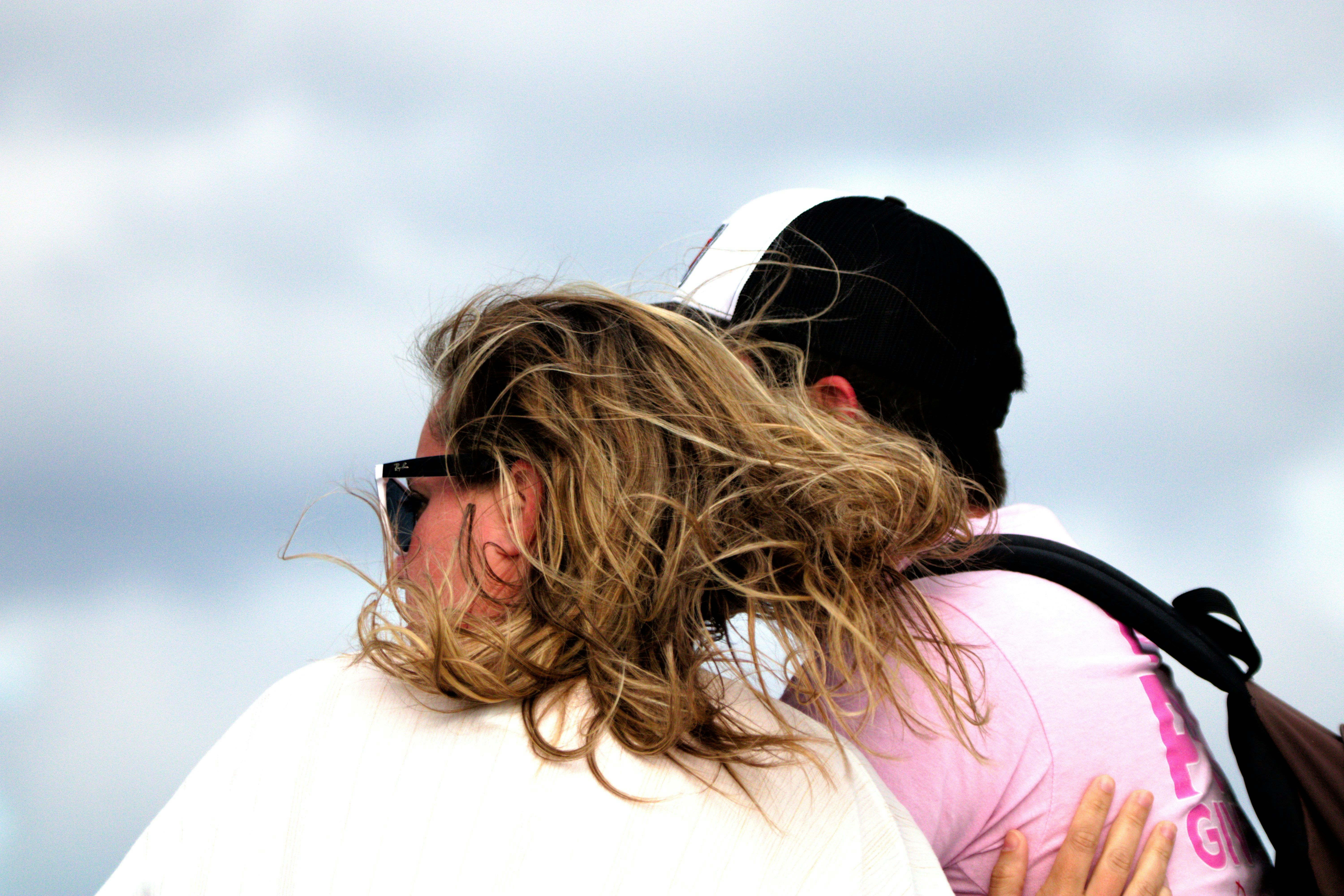 a couple of people that are hugging each other