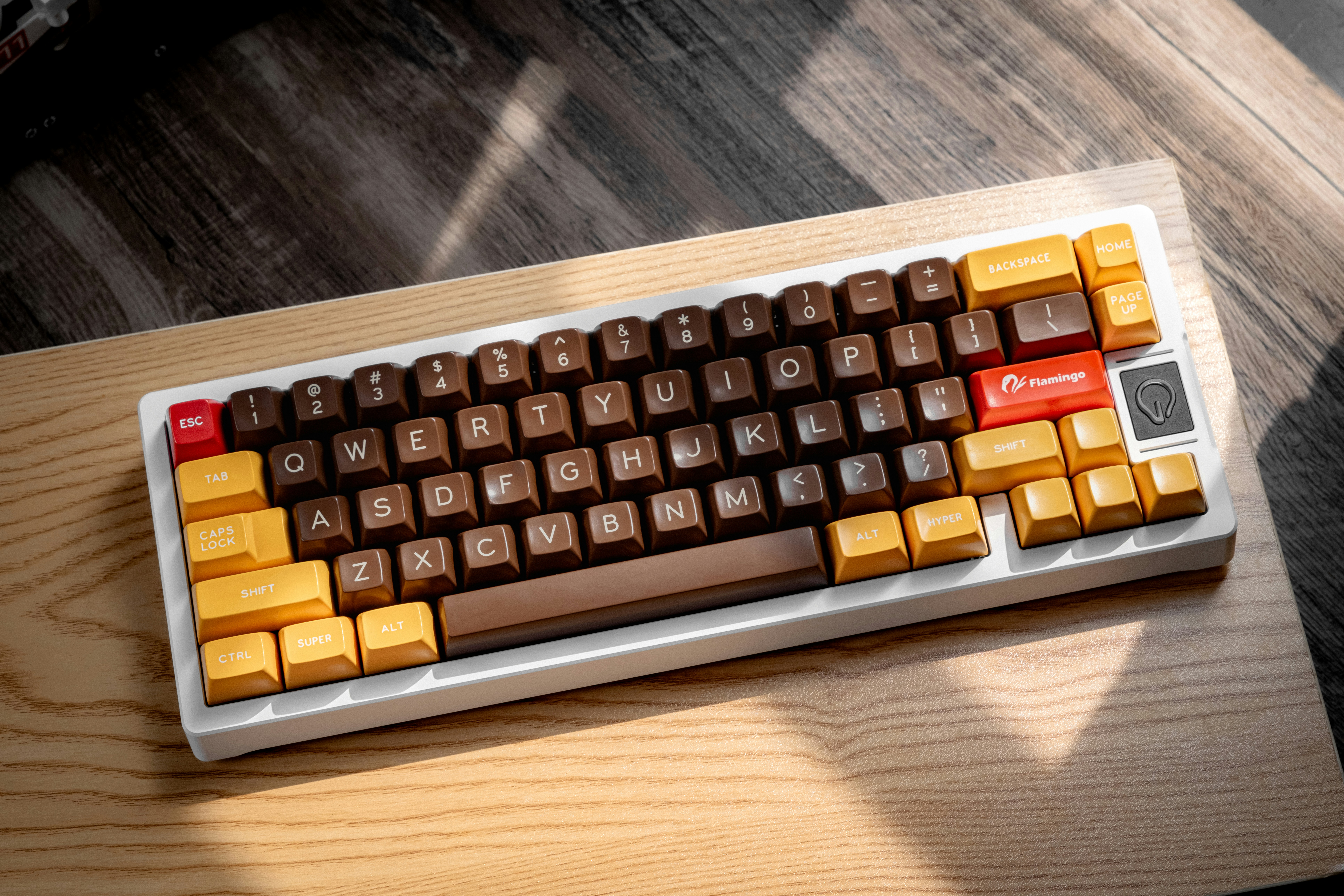 a computer keyboard sitting on top of a wooden table