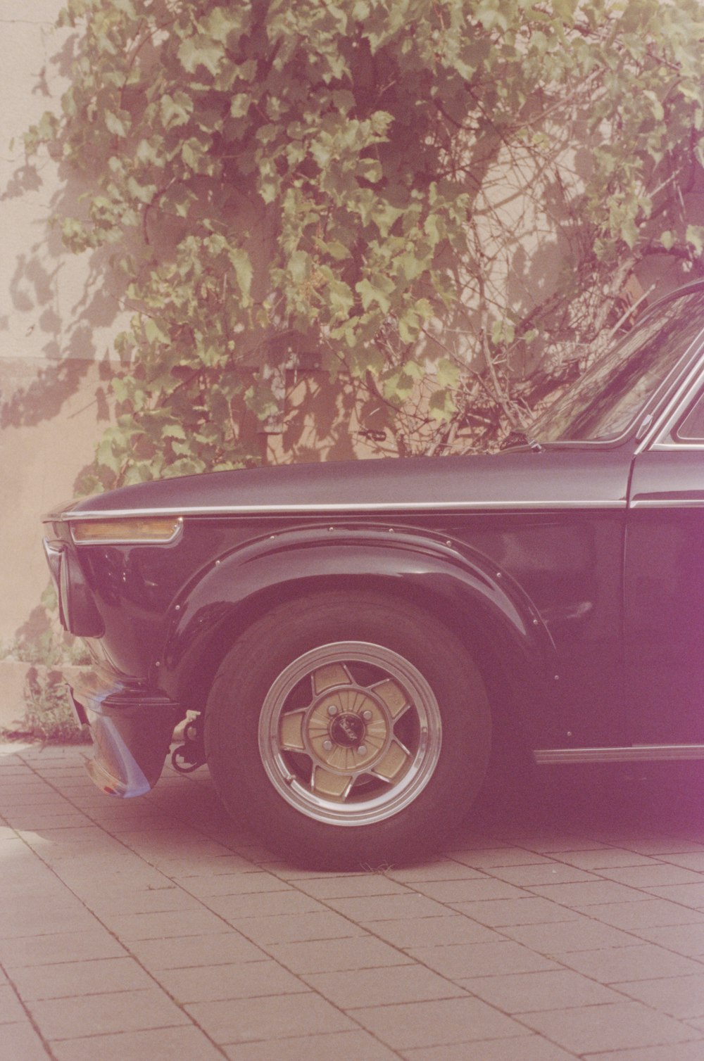 an old car parked on the side of the road