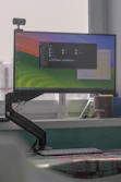a computer monitor sitting on top of a desk