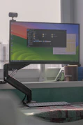 a computer monitor sitting on top of a desk