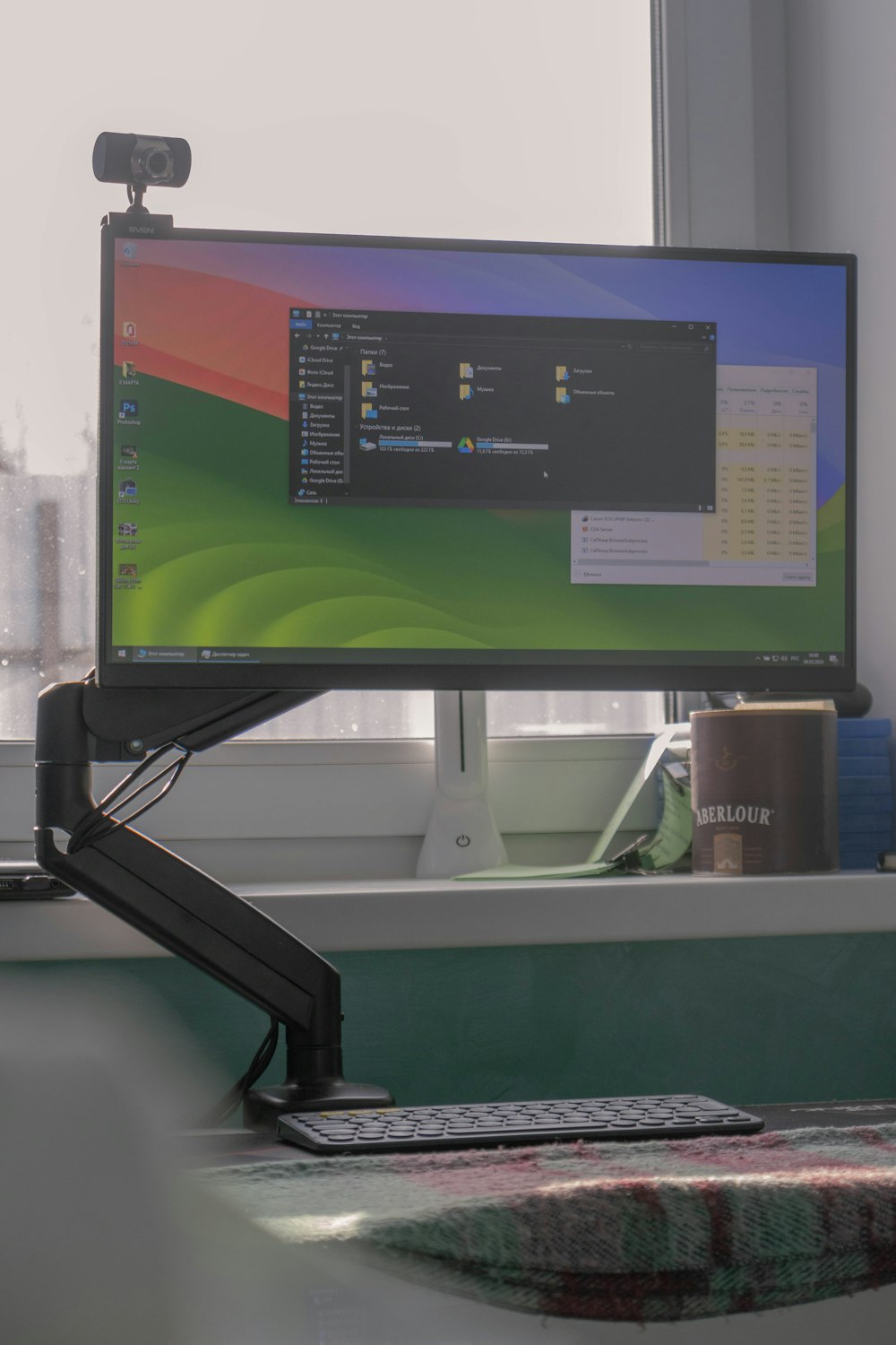a computer monitor sitting on top of a desk