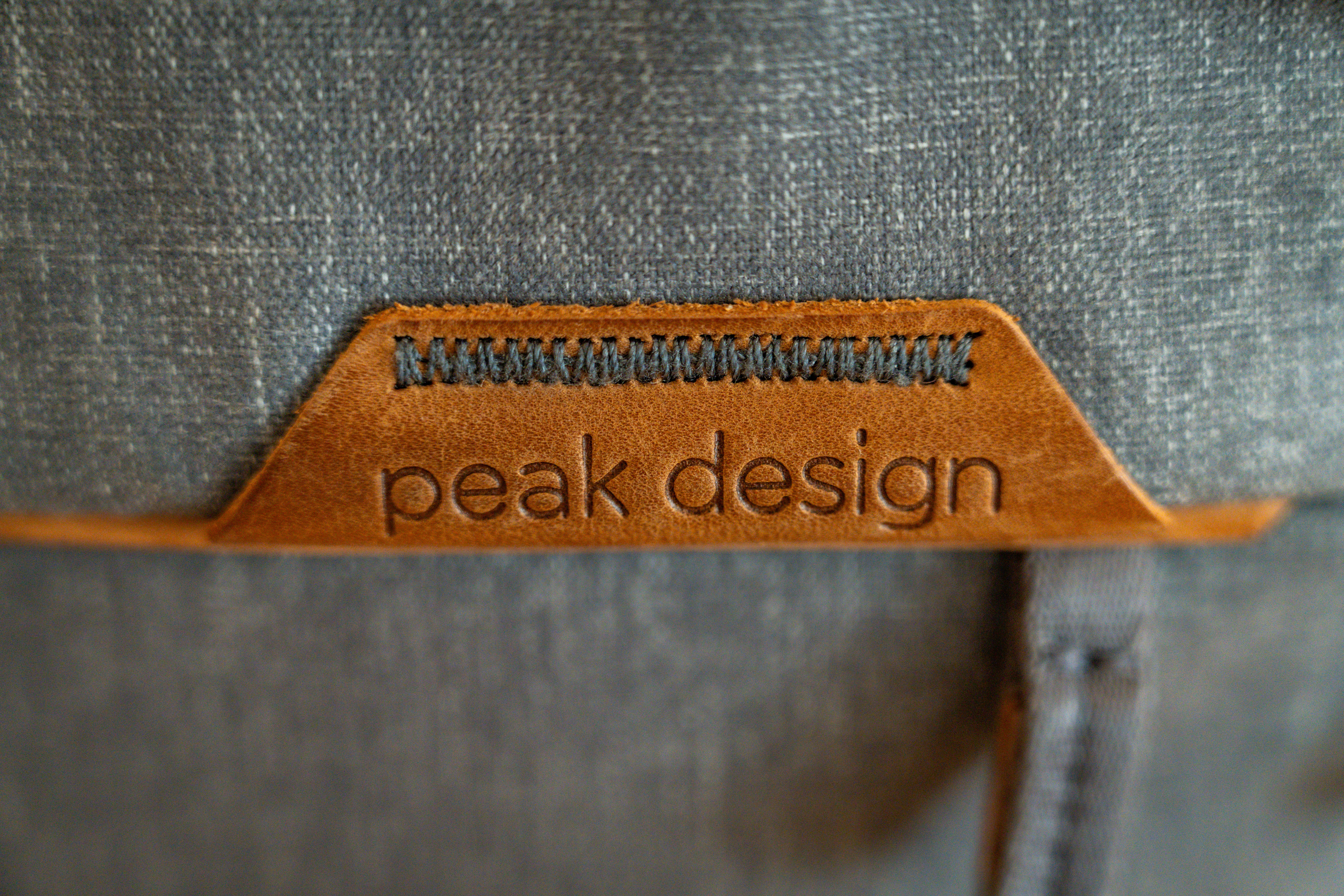 a bag with a leather label that says peak design