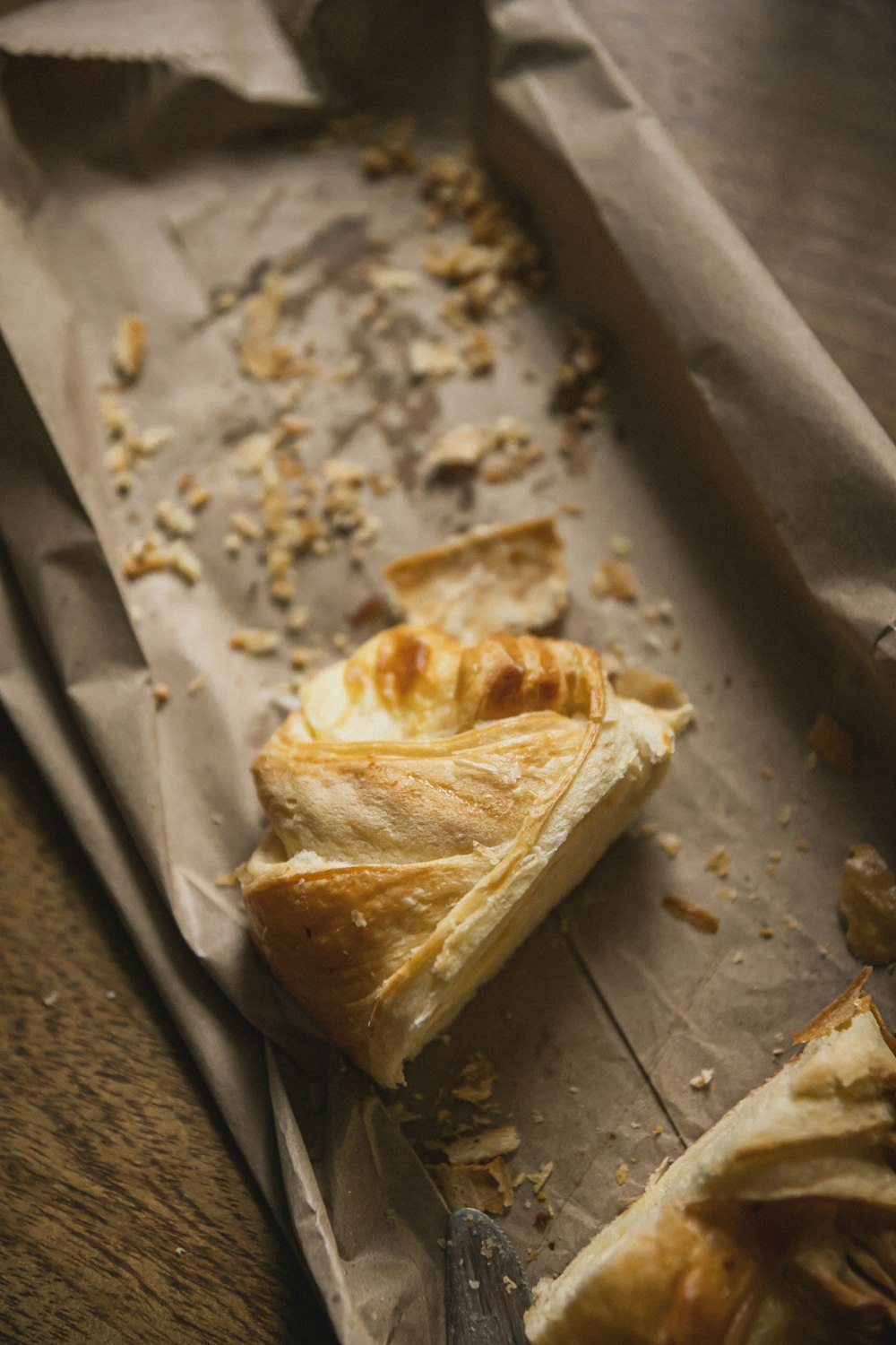 a piece of pie sitting on top of a piece of wax paper